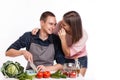 Happy young couple have fun in modern kitchen