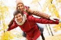 Happy young couple having fun in autumn park Royalty Free Stock Photo