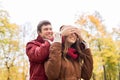 Happy young couple having fun in autumn park Royalty Free Stock Photo