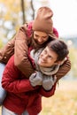 Happy young couple having fun in autumn park Royalty Free Stock Photo