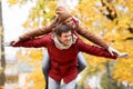 Happy young couple having fun in autumn park Royalty Free Stock Photo