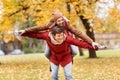 Happy young couple having fun in autumn park Royalty Free Stock Photo