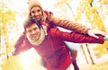 Happy young couple having fun in autumn park Royalty Free Stock Photo