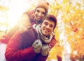 Happy young couple having fun in autumn park Royalty Free Stock Photo