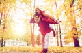 Happy young couple having fun in autumn park Royalty Free Stock Photo