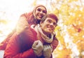 Happy young couple having fun in autumn park Royalty Free Stock Photo