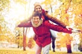 Happy young couple having fun in autumn park Royalty Free Stock Photo