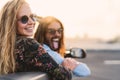 Happy young couple having fun doing road trip with trendy convertible car Royalty Free Stock Photo