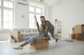 Happy young couple having fun in the living room of their new house or apartment Royalty Free Stock Photo