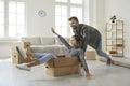 Happy young couple having fun in the newly bought house of their dream on moving day Royalty Free Stock Photo