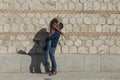 Happy young couple having fun outdoors on a sunny day. Urban, architecture. Fun and lifestyle Royalty Free Stock Photo