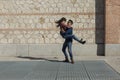 Happy young couple having fun outdoors on a sunny day. Urban, architecture. Fun and lifestyle Royalty Free Stock Photo