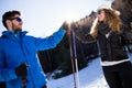 Happy young couple having fun over winter background. Royalty Free Stock Photo