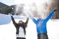 Happy young couple having fun over winter background. Royalty Free Stock Photo