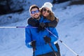 Happy young couple having fun over winter background. Royalty Free Stock Photo