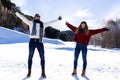 Happy young couple having fun over winter background. Royalty Free Stock Photo