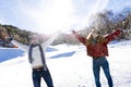 Happy young couple having fun over winter background. Royalty Free Stock Photo