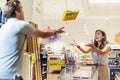 Young couple having fun in supermarket with shopping cart Royalty Free Stock Photo