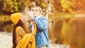 Happy young couple having fun together on nature in autumn. Autumn fashion and beauty. Healthy lifestyle, love and mood. Stylish Royalty Free Stock Photo