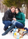 Happy young couple having fun in the winter park Royalty Free Stock Photo