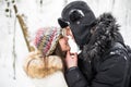 Happy young couple having fun in the winter park Royalty Free Stock Photo