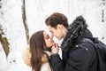 Happy young couple having fun in the winter park Royalty Free Stock Photo