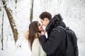 Happy young couple having fun in the winter park Royalty Free Stock Photo