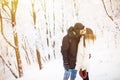Happy young couple having fun in the winter park Royalty Free Stock Photo