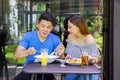 Happy young couple having lunch together in cafe Royalty Free Stock Photo