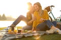 Happy young couple having picnic near lake Royalty Free Stock Photo
