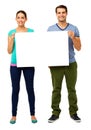 Happy Young Couple Holding Billboard Royalty Free Stock Photo