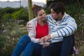 Happy young couple holding each other in the garden Royalty Free Stock Photo