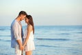 Happy young couple holding hands at beach Royalty Free Stock Photo