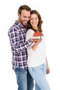 Happy young couple holding model house Royalty Free Stock Photo