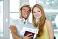 happy young couple holding passports and air travel tickets Royalty Free Stock Photo