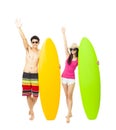 Happy young couple holding surfboard Royalty Free Stock Photo