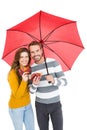 Happy young couple holding umbrella Royalty Free Stock Photo