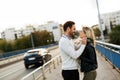 Happy young couple hugging and kissing on bridge Royalty Free Stock Photo