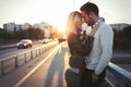 Happy young couple hugging and kissing on bridge Royalty Free Stock Photo