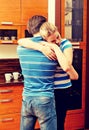 Happy young couple hugging in the kitchen Royalty Free Stock Photo