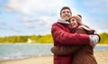 Happy young couple hugging over autumn beach Royalty Free Stock Photo