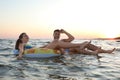 Happy young couple on inflatable rings