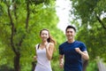 Happy young Couple jogging and running  in park Royalty Free Stock Photo