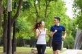 Happy young Couple jogging and running  in park Royalty Free Stock Photo