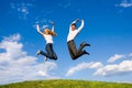 Happy Young Couple jumping Royalty Free Stock Photo