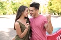 Happy young couple with key standing near new car Royalty Free Stock Photo