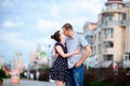 Happy young couple kissing in the city