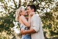 happy young couple kissing and hugging outdoors Royalty Free Stock Photo