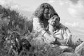 Happy Young Couple Laying On Blanket on grass near fireplace in balck and white Royalty Free Stock Photo
