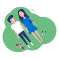 Happy young couple laying on green grass. Royalty Free Stock Photo